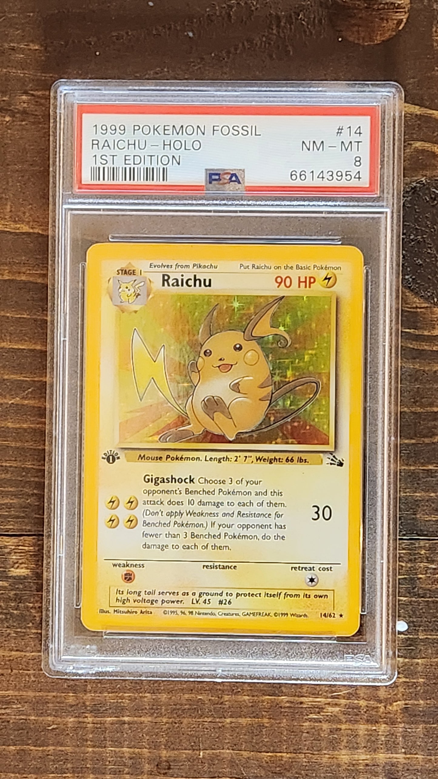 1999 Pokemon 1st Edition Fossil Raichu Holo 14/62  Psa 8